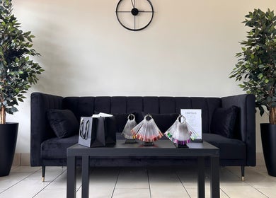 Elegant waiting area at House of Luxxe Beauty Salon, Yate, England, GB with modern decor and seating.
