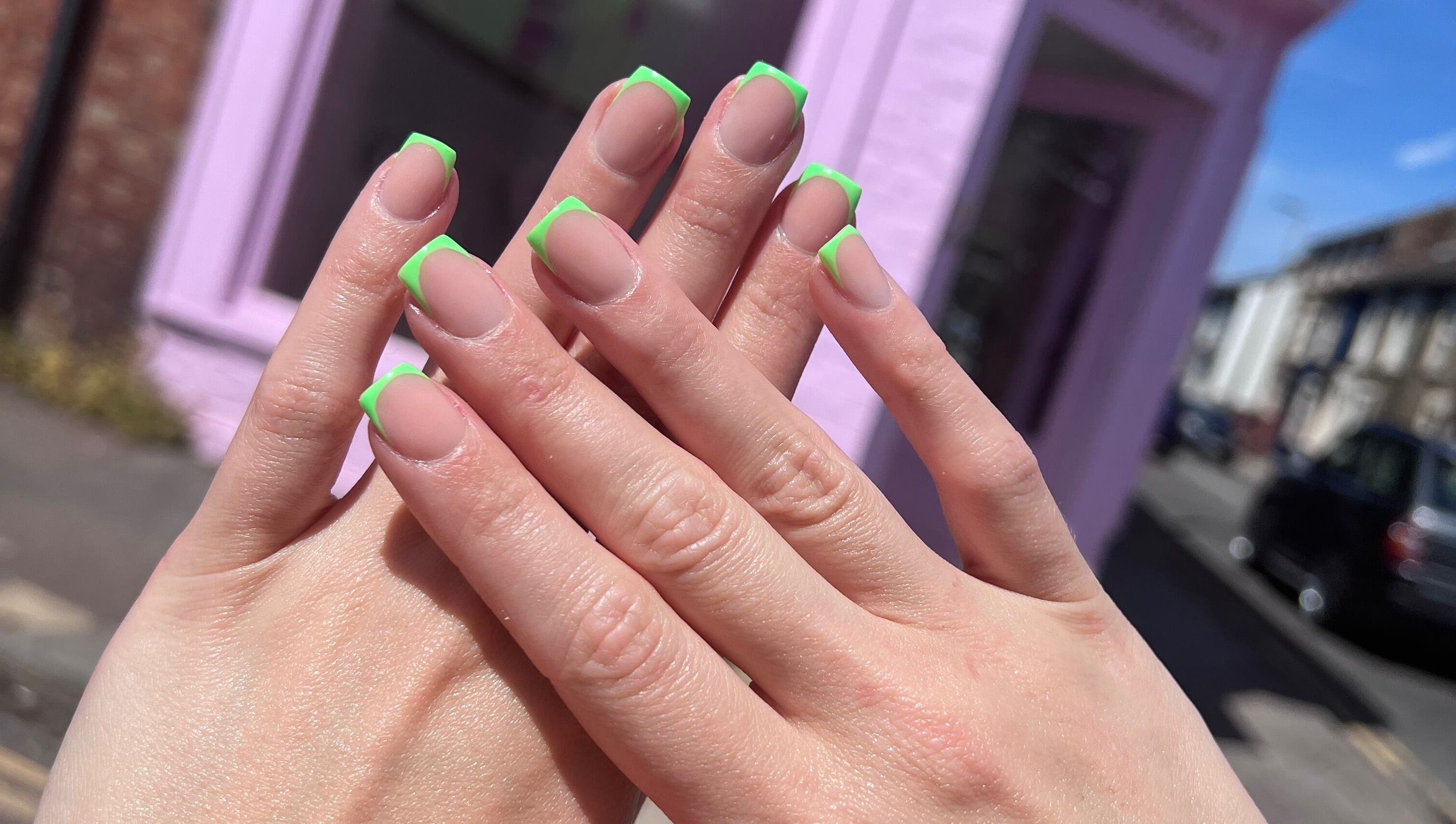 Stylish neon green French manicure at Glam’d by Sisanda, Rushden, England, GB.