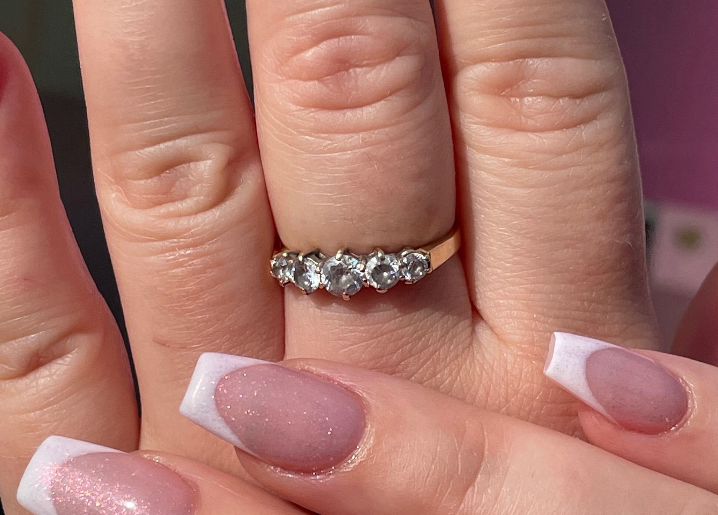 Stylish French manicure with diamond ring at Glam’d by Sisanda, Rushden, England, GB.