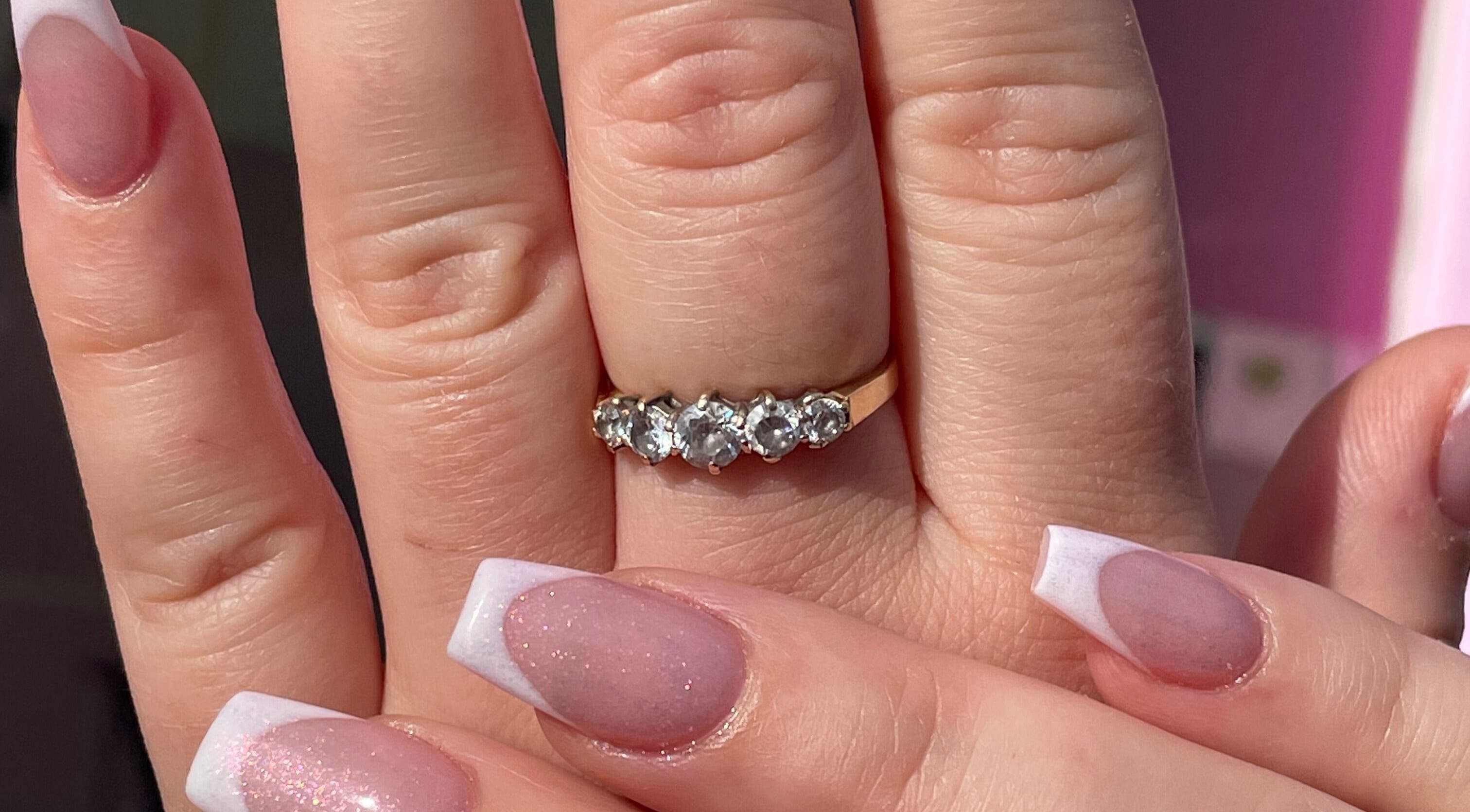 Stylish French manicure with diamond ring at Glam’d by Sisanda, Rushden, England, GB.