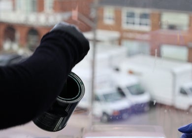 Fresca Beauty artisan in Toronto, Ontario, CA, crafting with care near studio window.