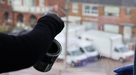 Fresca Beauty artisan in Toronto, Ontario, CA, crafting with care near studio window.