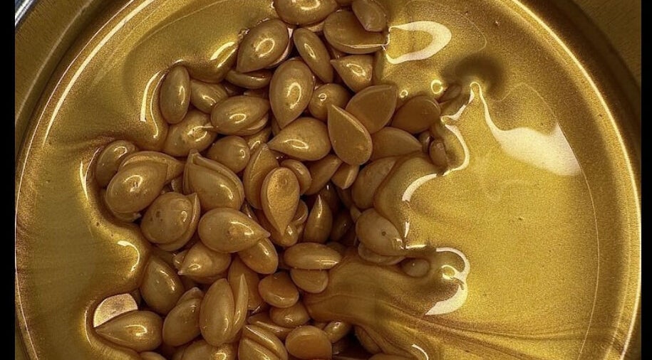 Gold wax beans at Fresca Beauty, Toronto, Ontario, CA, ready for a luxurious waxing session.