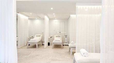 Luxurious treatment room at The Whitening Clinic in Waverley, New South Wales, AU featuring white decor.