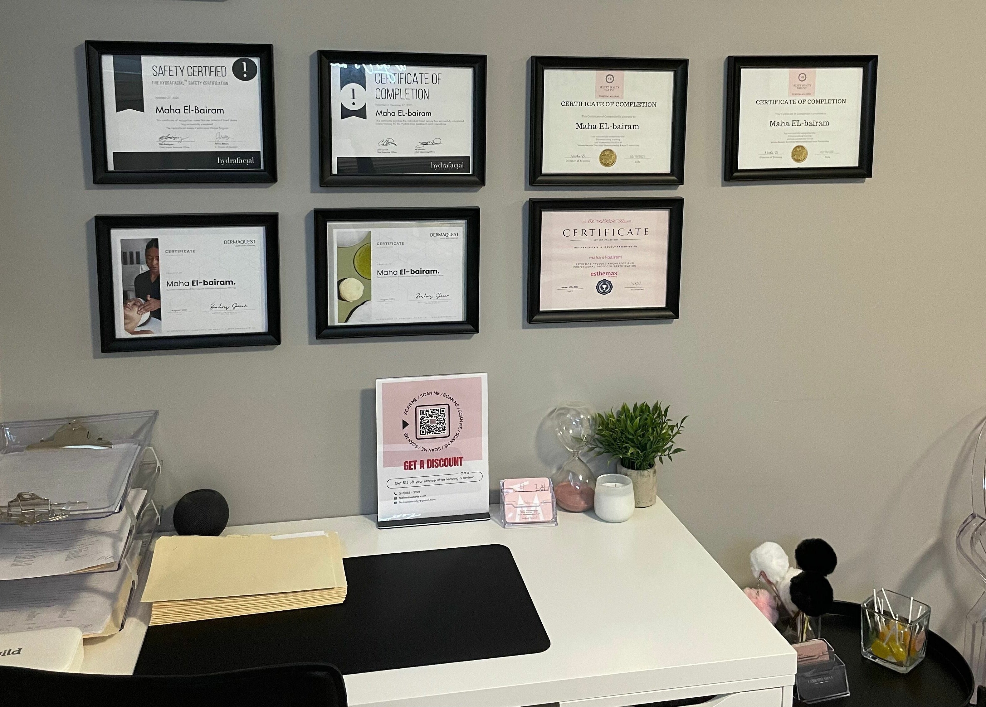 Certified workspace at Mahaabeautyy, ORLEANS, Ontario, CA, displaying professional certificates and desk setup.