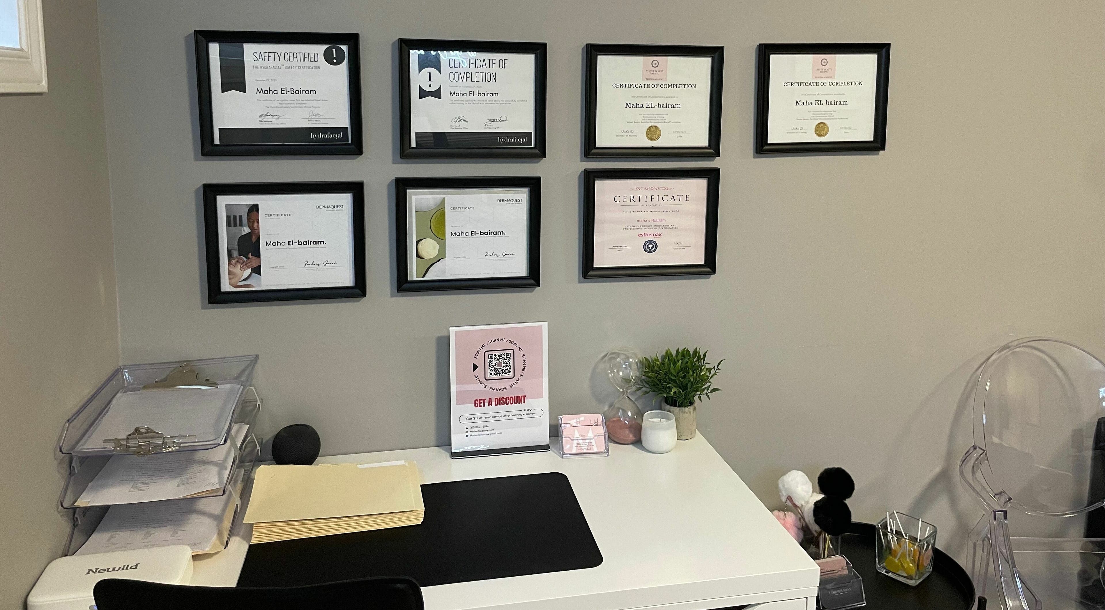 Certified workspace at Mahaabeautyy, ORLEANS, Ontario, CA, displaying professional certificates and desk setup.