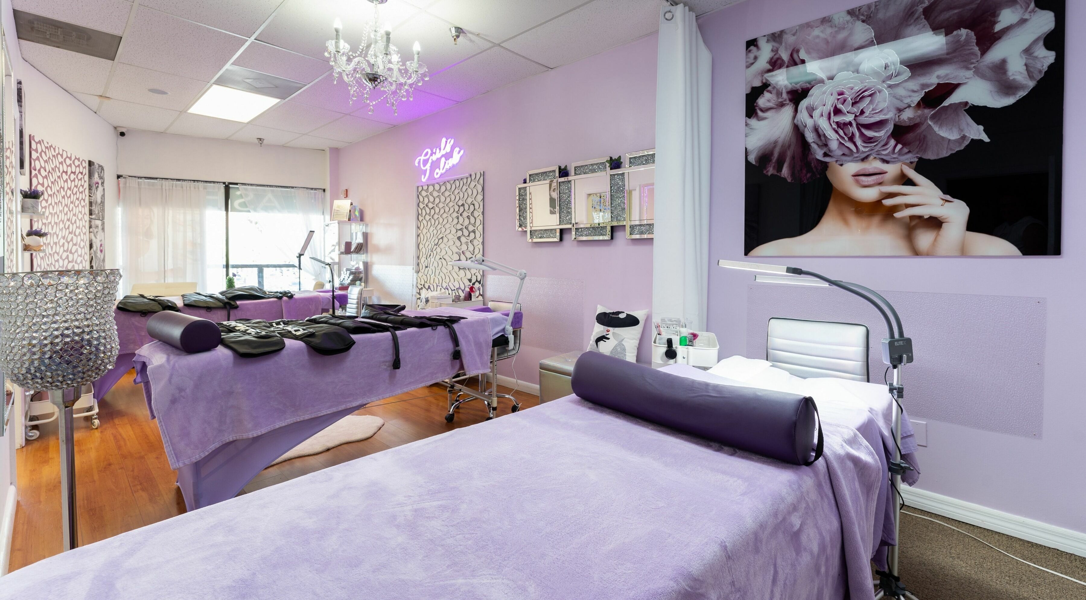 Health and Beauty Family spa room in Sunny Isles Beach, Florida, US, featuring lavender decor and plush treatment beds.