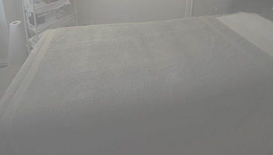 Relaxing massage bed setup at Aestherapy By Sophie Shakira, Knowle, England, GB for spa and wellness.