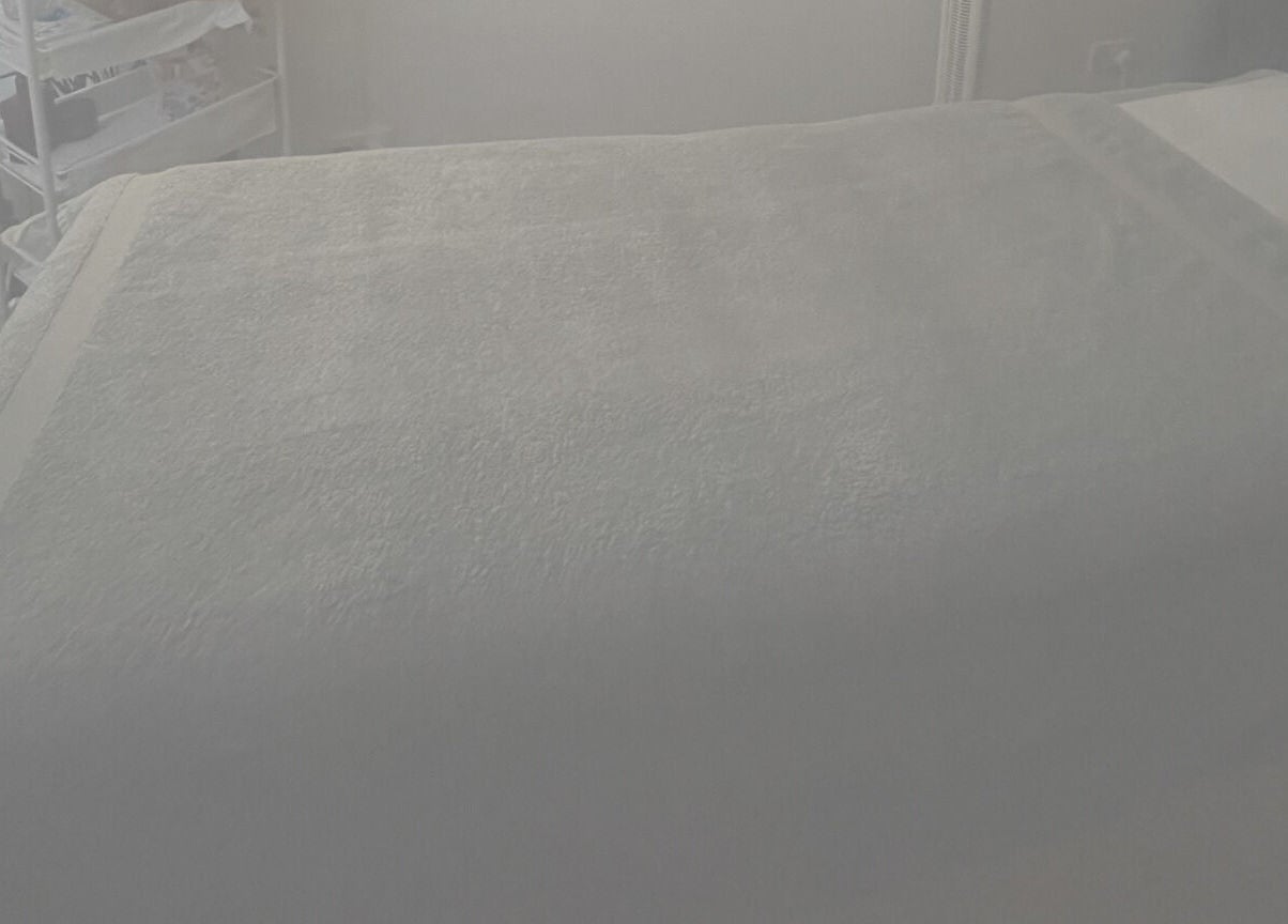 Relaxing massage bed setup at Aestherapy By Sophie Shakira, Knowle, England, GB for spa and wellness.