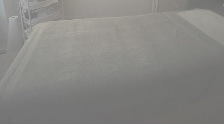 Relaxing massage bed setup at Aestherapy By Sophie Shakira, Knowle, England, GB for spa and wellness.