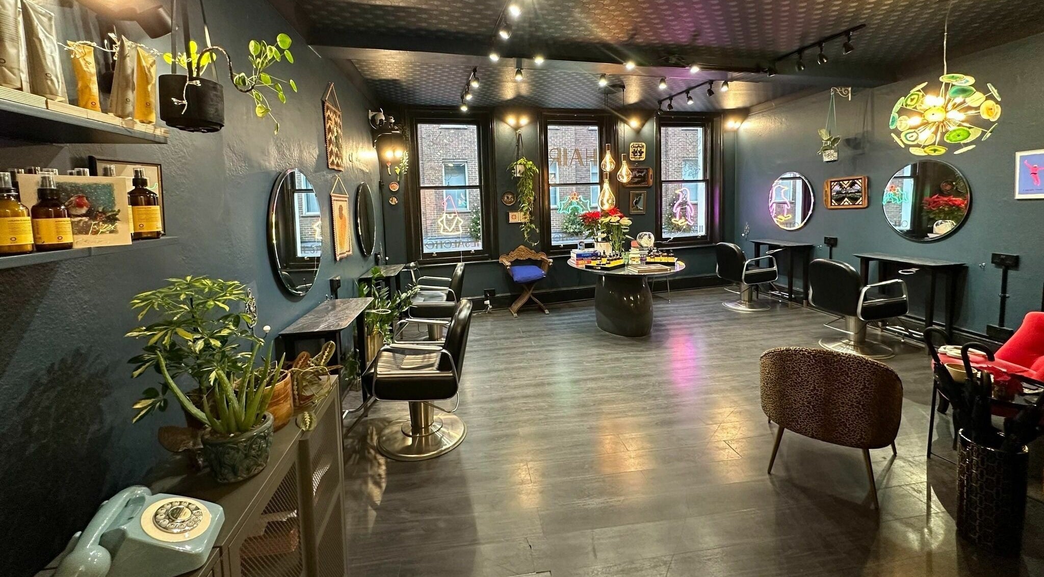 Stylish interior of Il Salotto in London, England, GB, featuring modern decor and salon chairs.