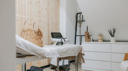 Sophia Georgiou Salon therapy room, Stockport, England, GB, featuring massage bed and calming decor.