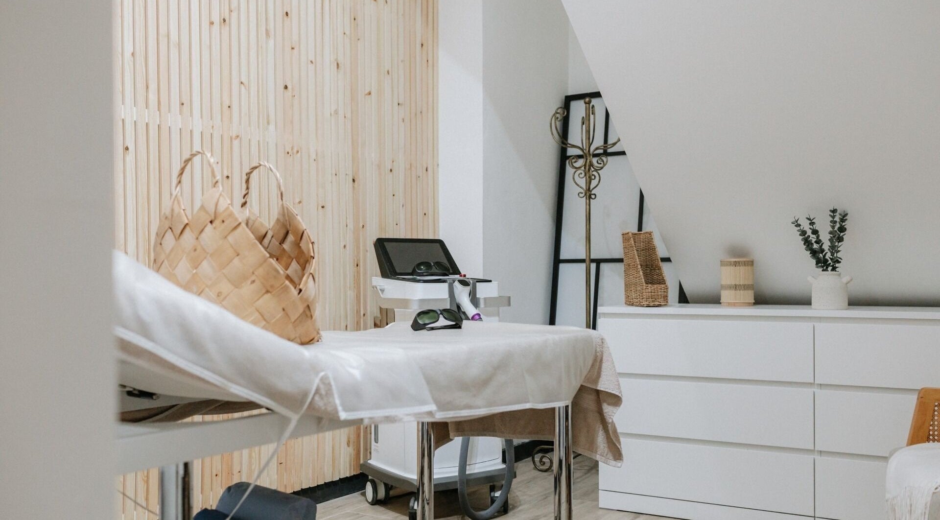 Sophia Georgiou Salon therapy room, Stockport, England, GB, featuring massage bed and calming decor.