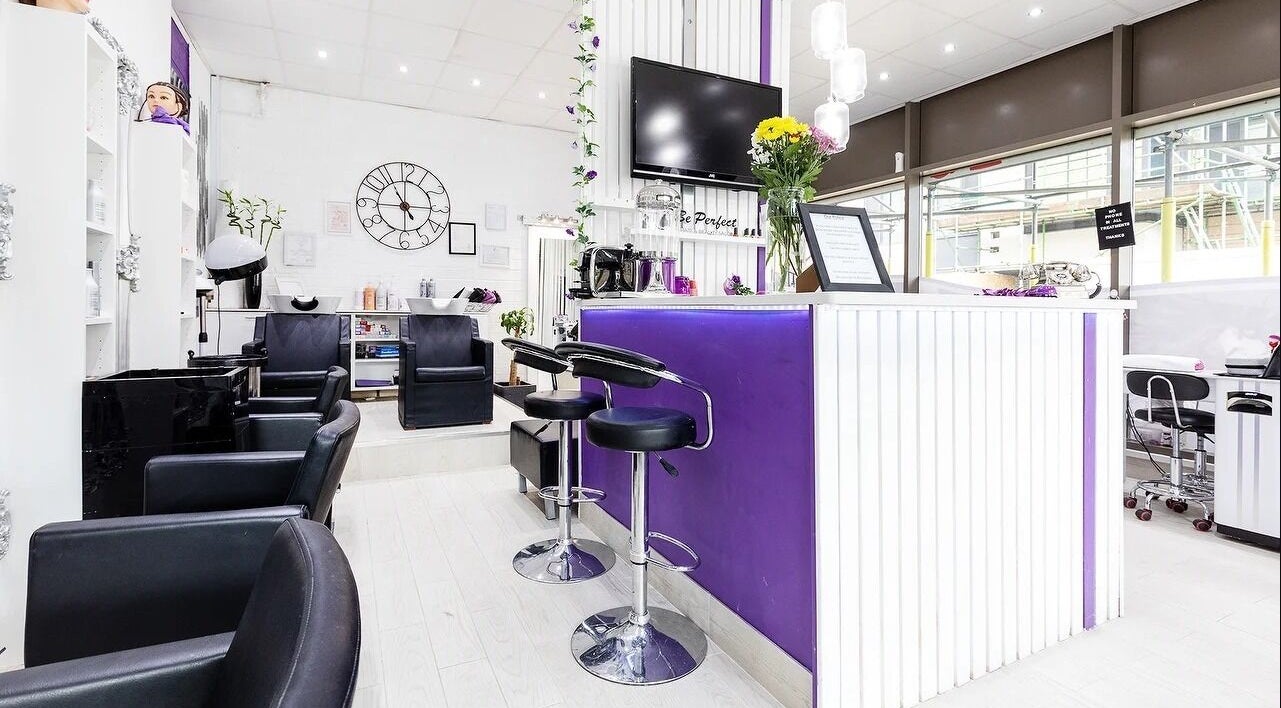 Modern interior of Be Perfect Hair and Beauty Salon, London, England, GB with stylish decor and seating.