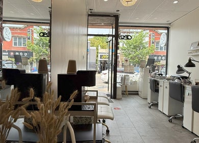 Serene interior of Sarang Nails, Toronto, Ontario, CA with modern nail stations and cozy seating.