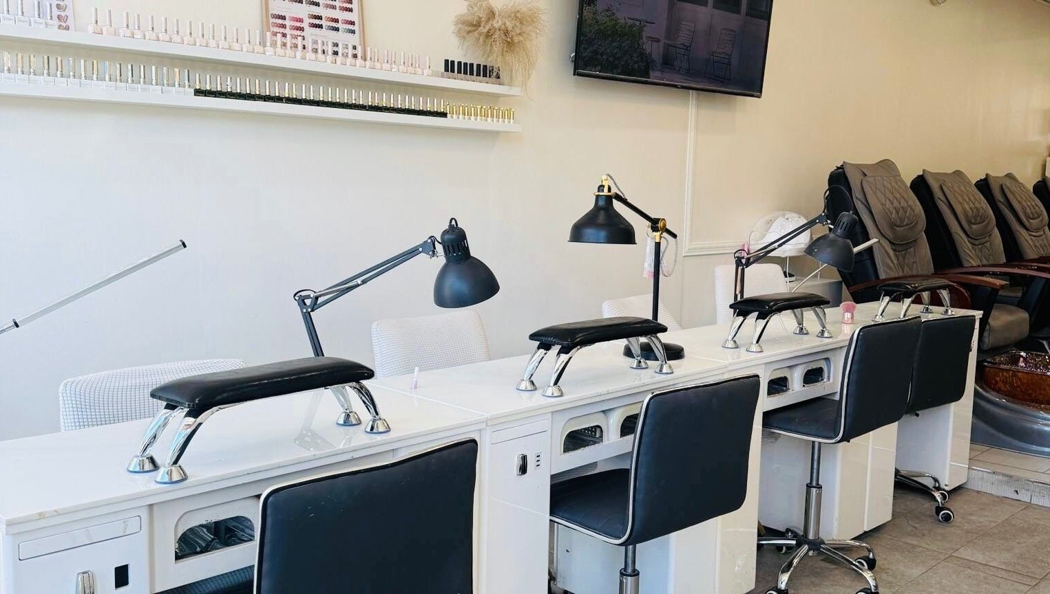 Modern nail stations at Sarang Nails in Toronto, Ontario, CA, featuring sleek design and comfortable seating.