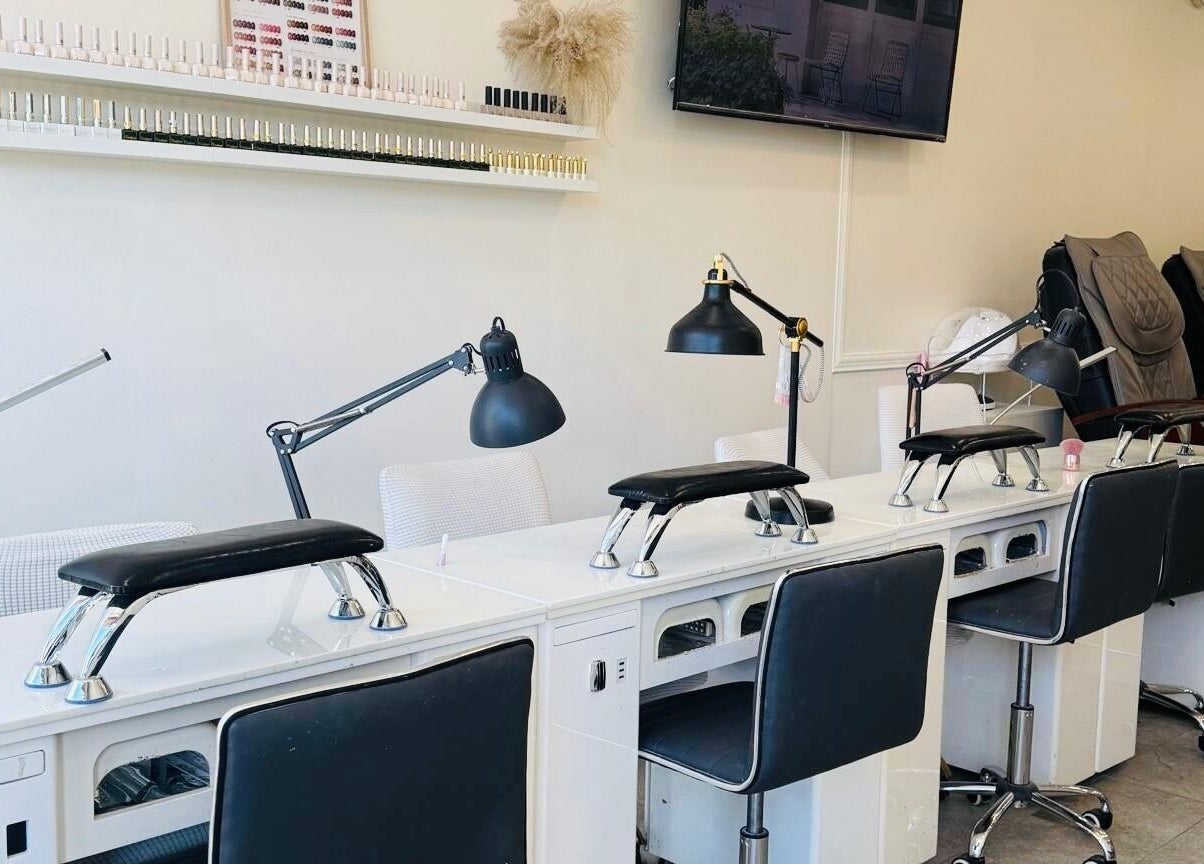 Modern nail stations at Sarang Nails in Toronto, Ontario, CA, featuring sleek design and comfortable seating.