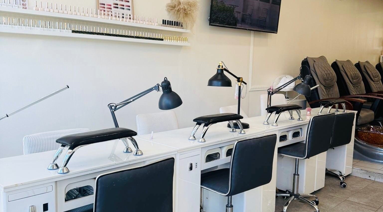 Modern nail stations at Sarang Nails in Toronto, Ontario, CA, featuring sleek design and comfortable seating.
