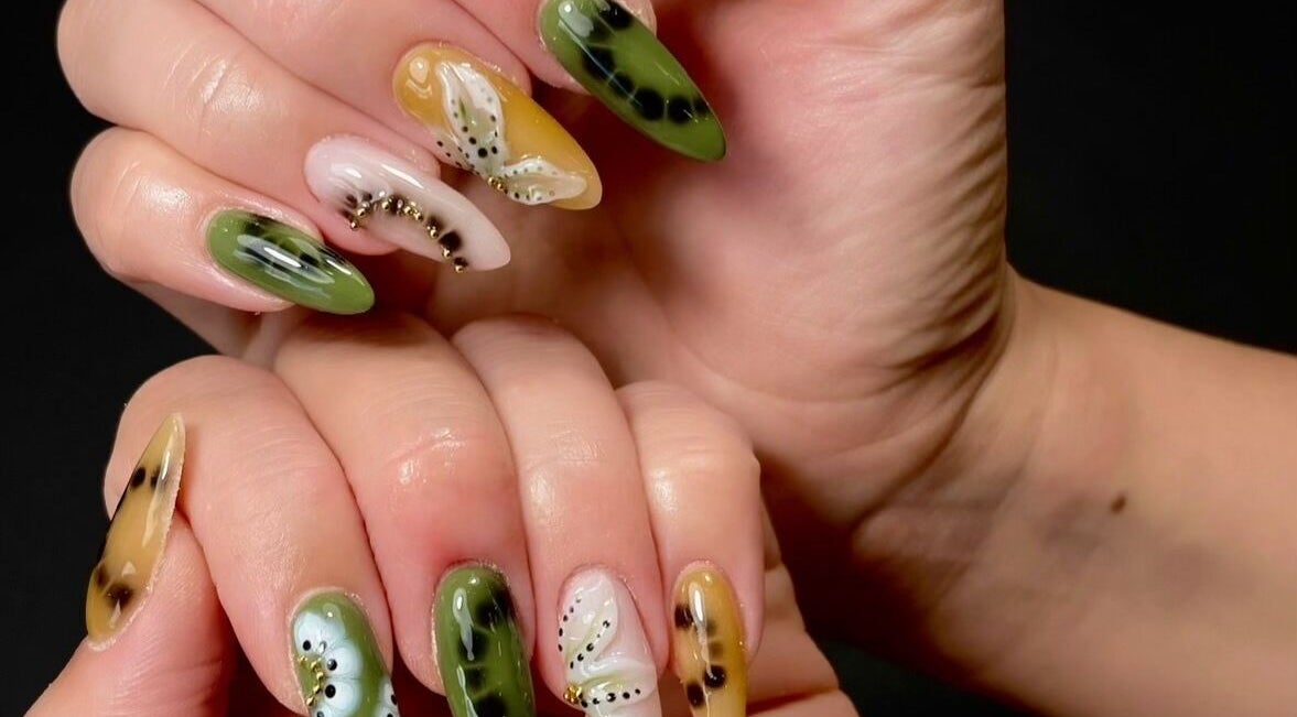 Colorful nail art at Sarang Nails, Toronto, Ontario, CA showcasing intricate designs with green and yellow hues.