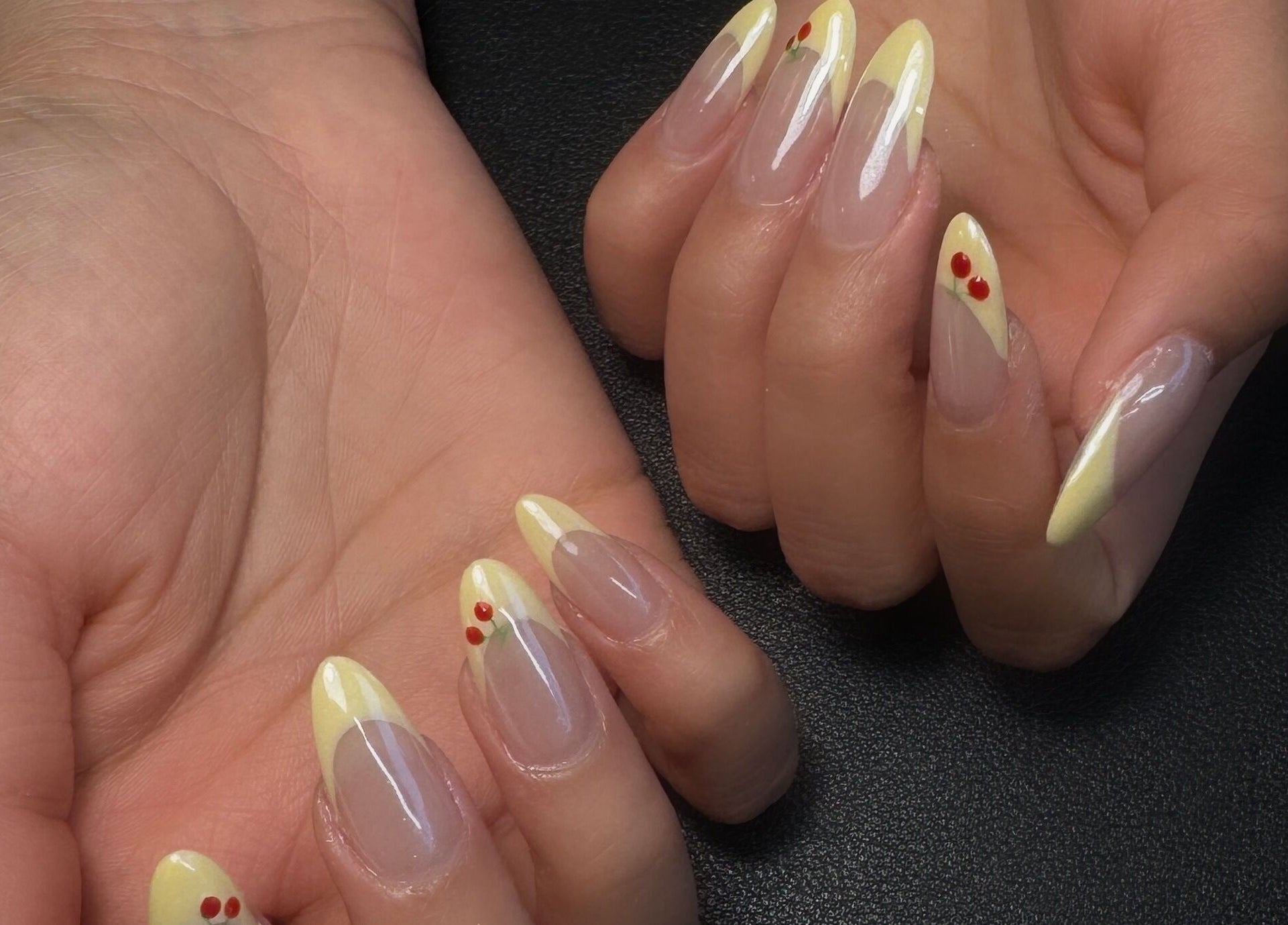 Elegant yellow and cherry nail art at Sarang Nails, Toronto, Ontario, CA.