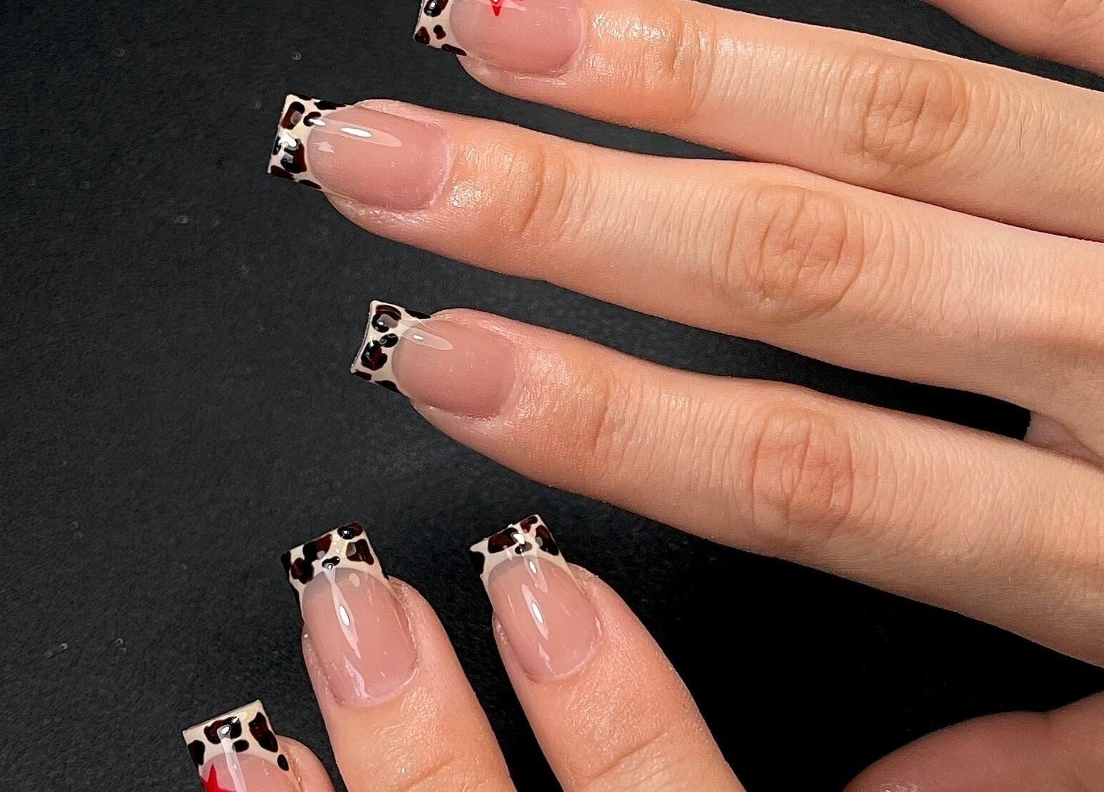 Leopard print nail art at Sarang Nails in Toronto, Ontario, CA. Stylish and trendy design.