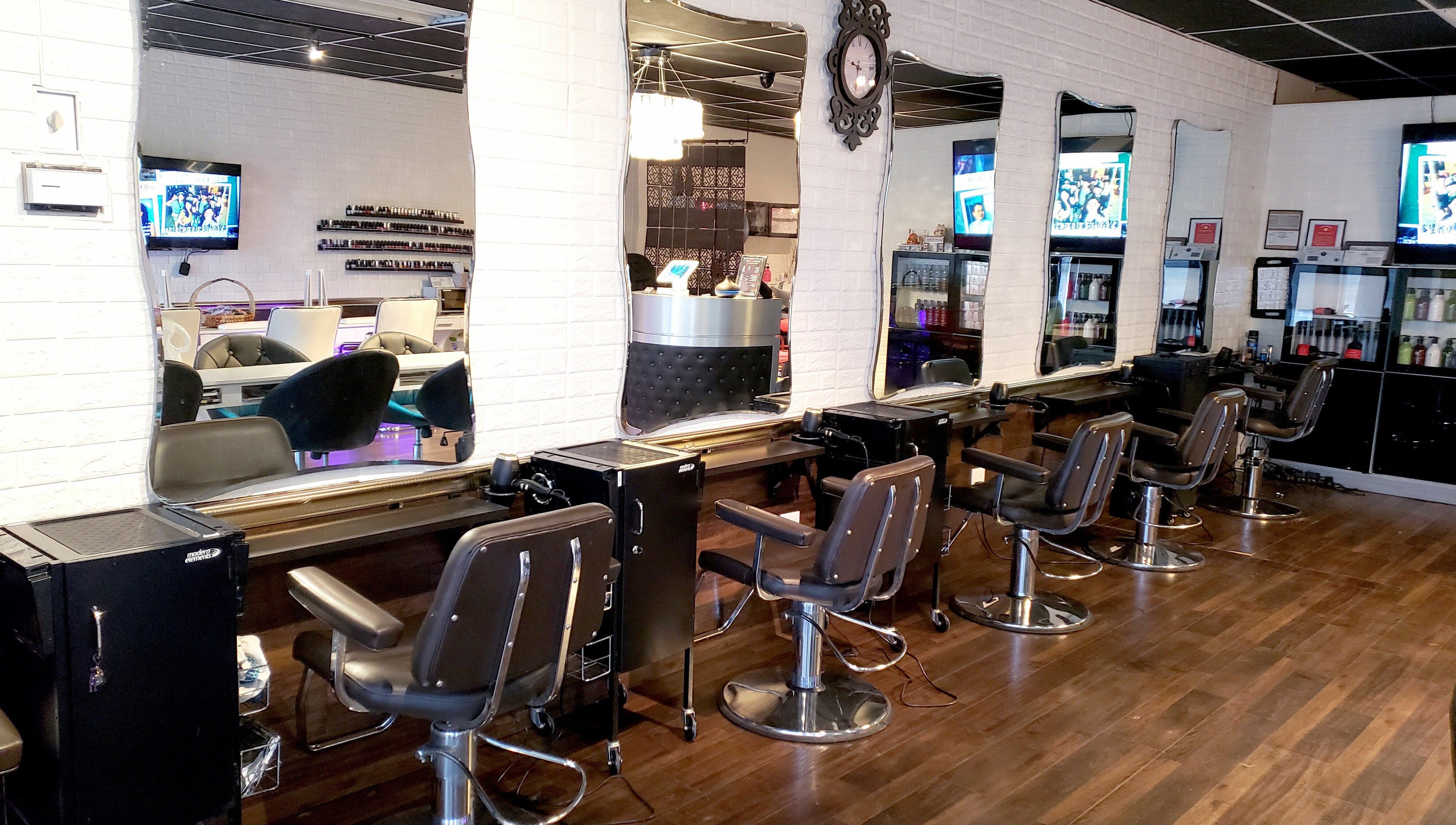 Modern salon chairs and mirrors at Hair Club 20 | San Gabriel, California, US, showcasing a chic interior design.