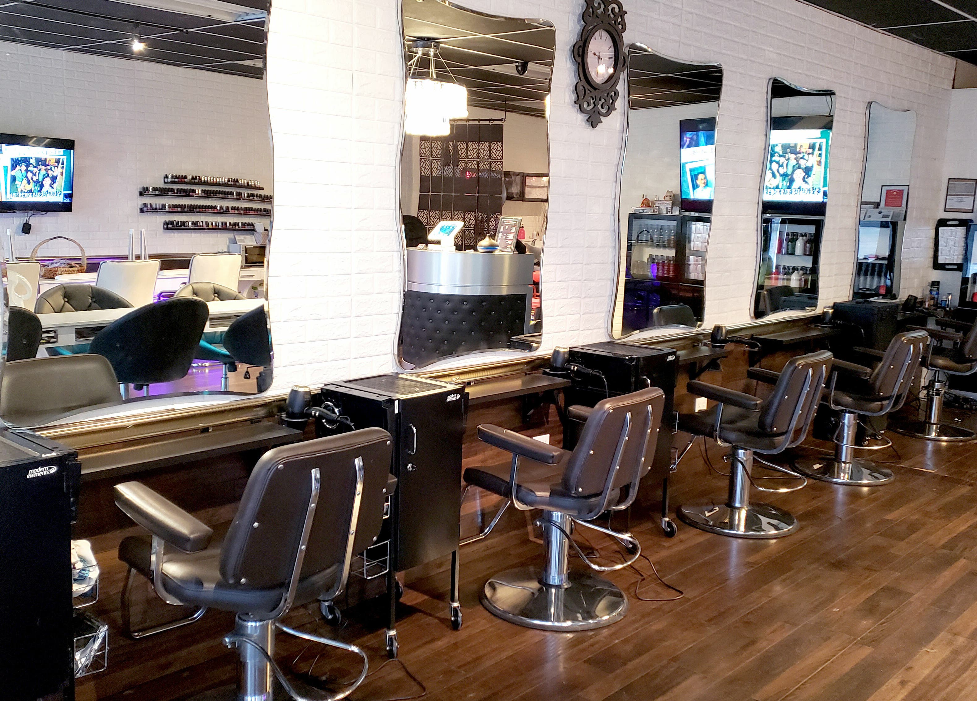 Modern salon chairs and mirrors at Hair Club 20 | San Gabriel, California, US, showcasing a chic interior design.