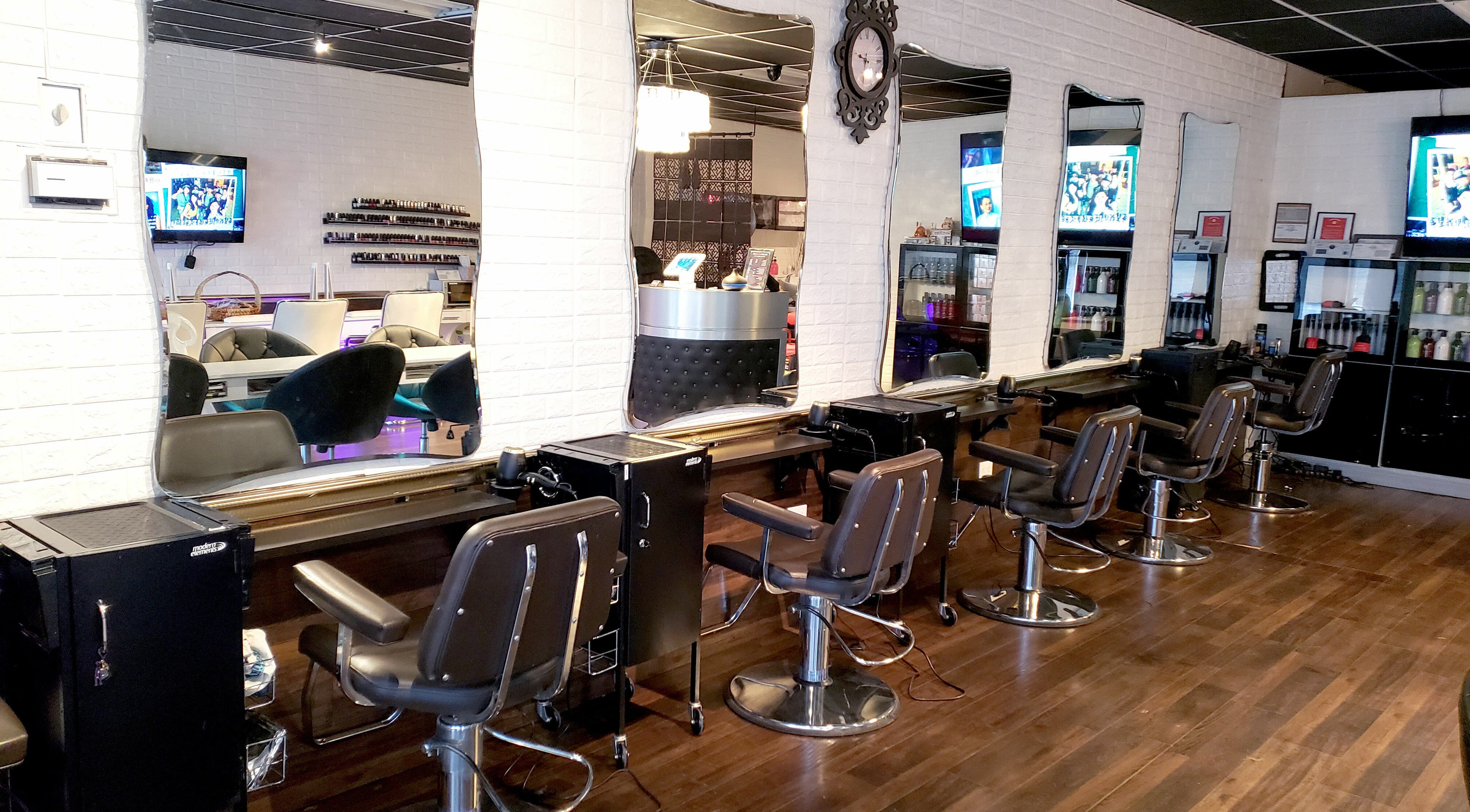 Modern salon chairs and mirrors at Hair Club 20 | San Gabriel, California, US, showcasing a chic interior design.