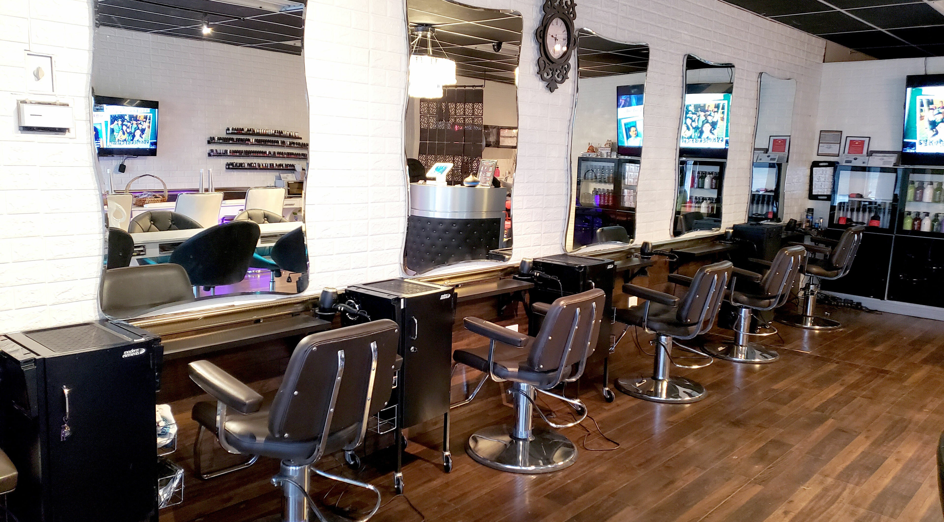 Modern salon chairs and mirrors at Hair Club 20 | San Gabriel, California, US, showcasing a chic interior design.