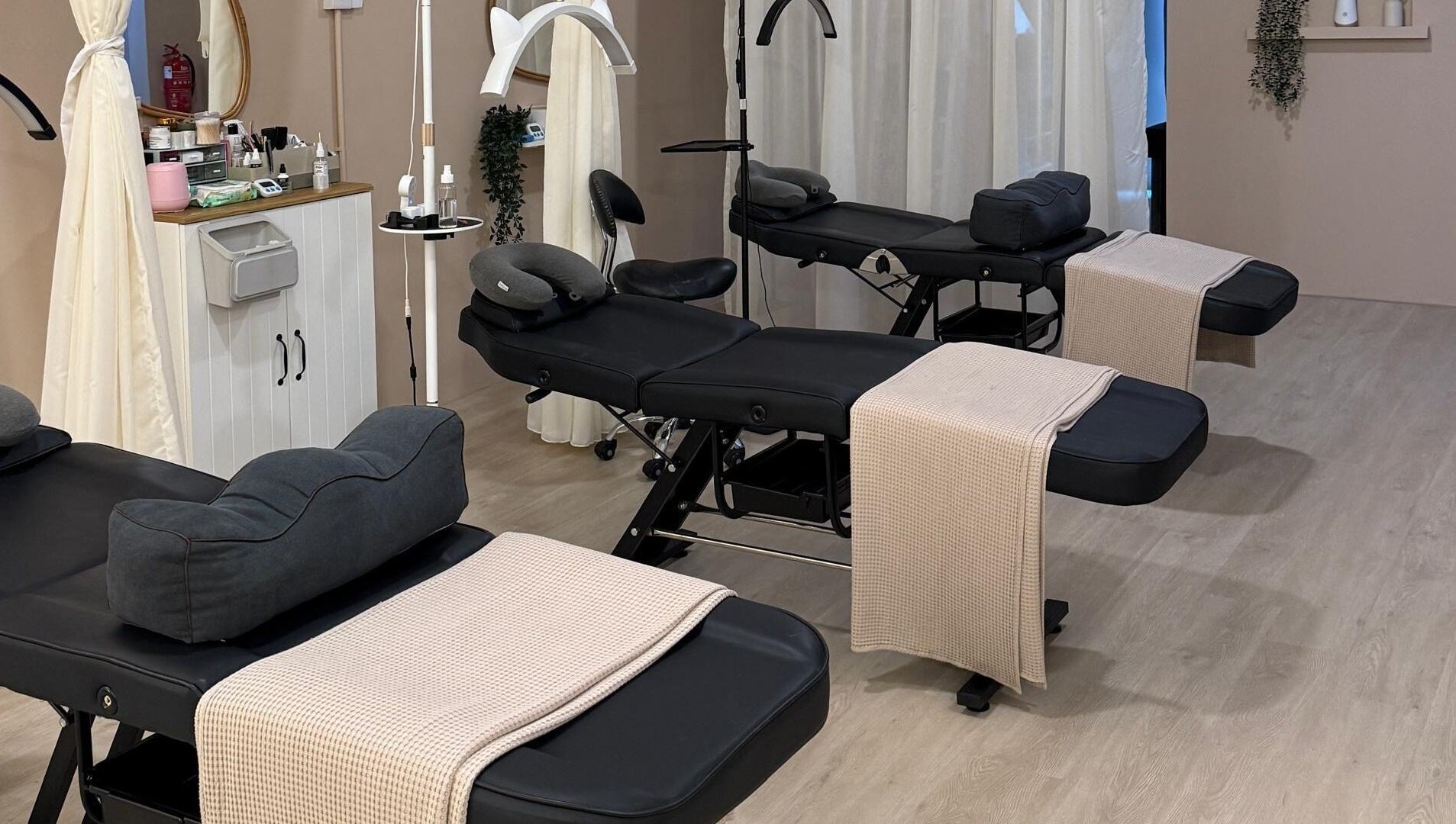 Comfortable treatment beds at Abby Beaute Studio, Cyberjaya, Selangor, MY, providing a serene atmosphere.