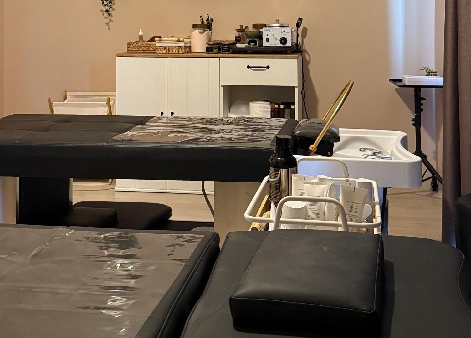 Calm treatment room at Abby Beaute Studio, Cyberjaya, Selangor, MY with massage tables and wellness equipment.