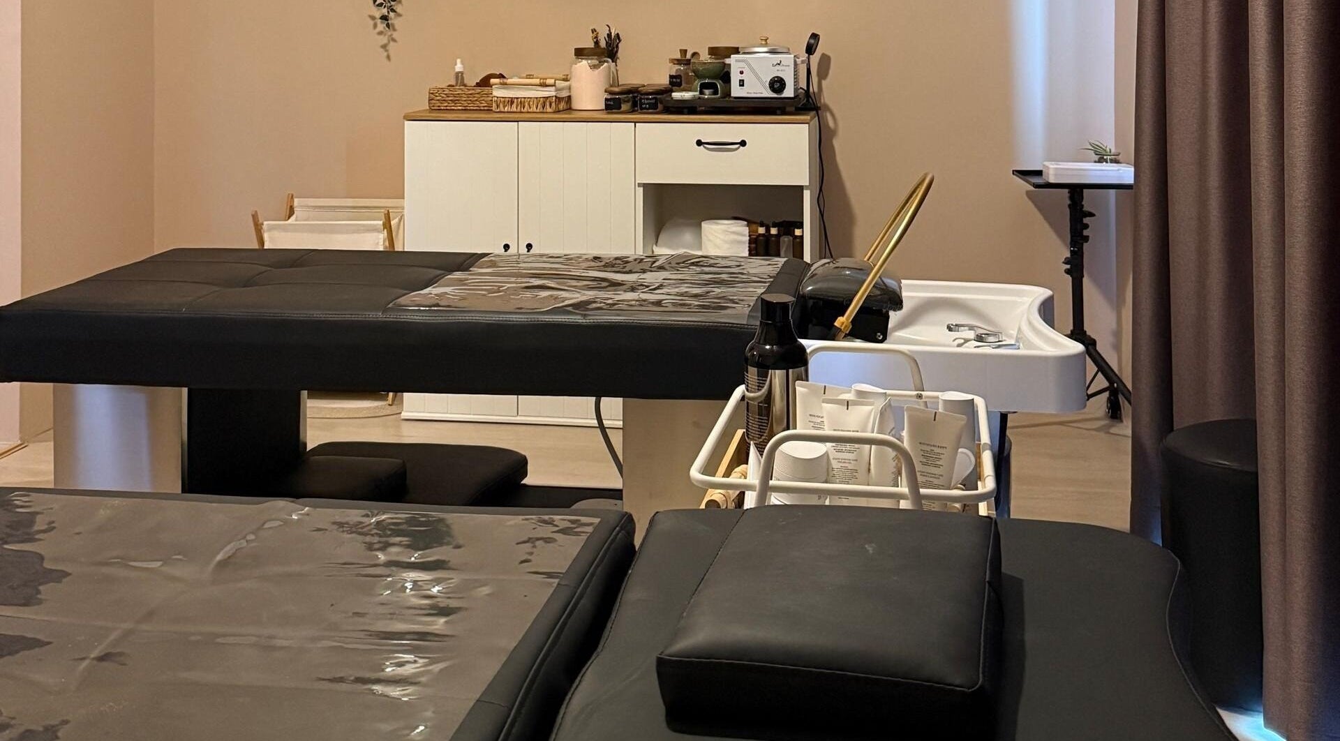 Calm treatment room at Abby Beaute Studio, Cyberjaya, Selangor, MY with massage tables and wellness equipment.