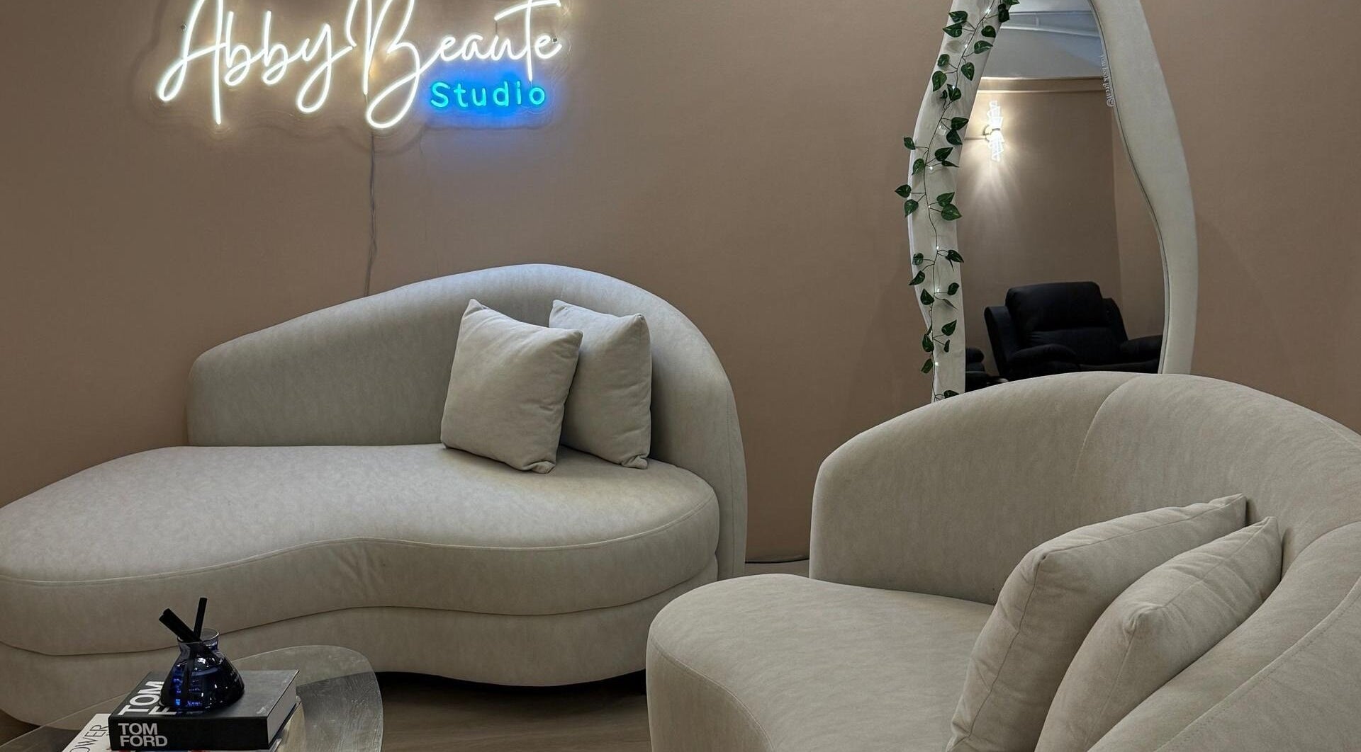 Elegant seating area at Abby Beaute Studio, Cyberjaya, Selangor, MY with cozy sofas and modern decor.