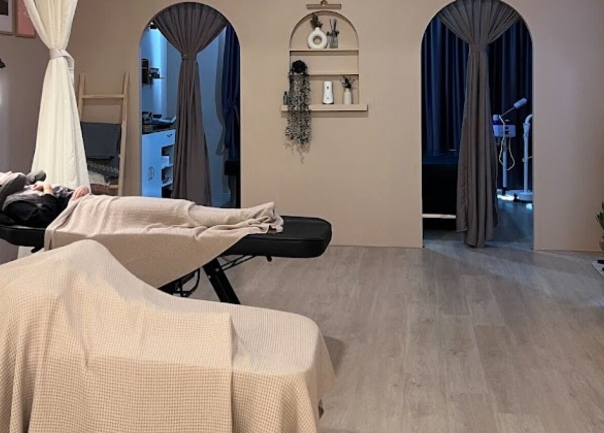 Relaxing spa treatment room at Abby Beaute Studio, Cyberjaya, Selangor, MY, featuring elegant decor and comfortable beds.