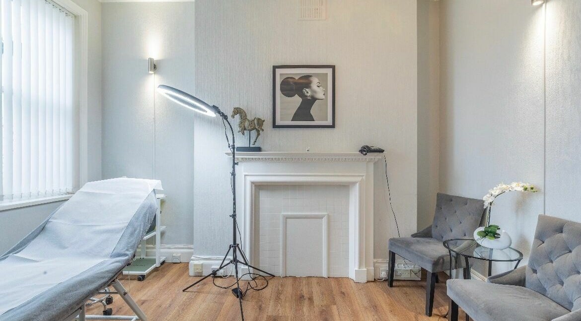 Elegant treatment room at Dr Deena Aesthetics, London, England, GB, featuring a tranquil and professional setup.