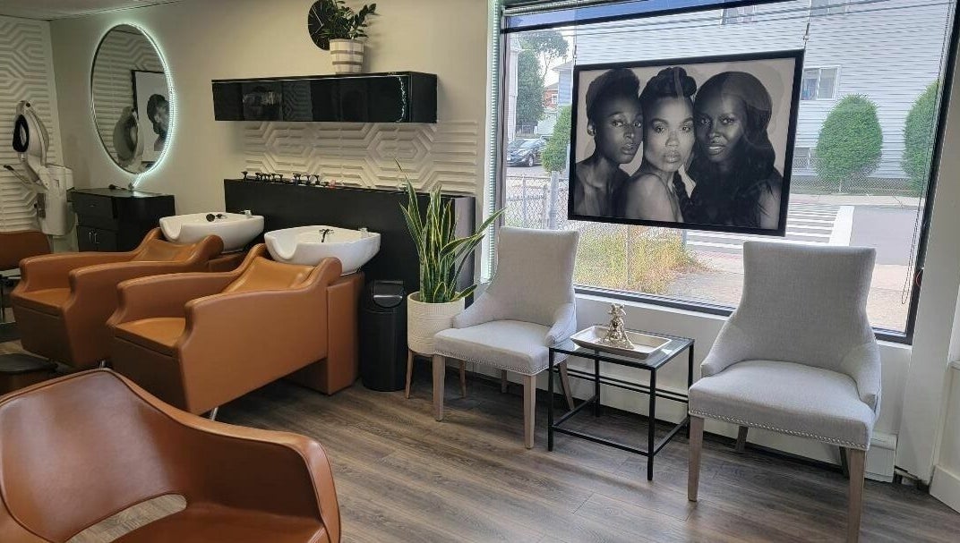 Elegant salon interior of STUDIO 27 SALON in Everett, Massachusetts, US with stylish chairs and modern decor.