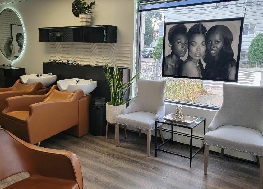 Elegant salon interior of STUDIO 27 SALON in Everett, Massachusetts, US with stylish chairs and modern decor.