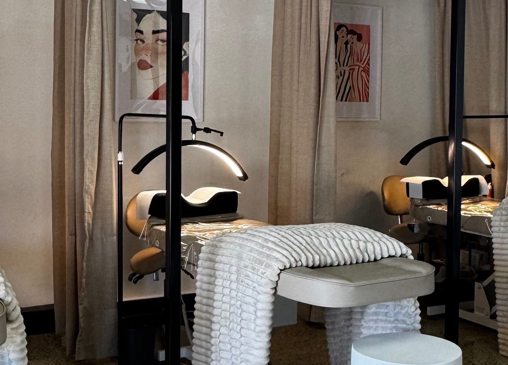 Cozy treatment room at All-Eyes Beauty, Falcon, Western Australia, AU with plush chairs and gentle lighting.