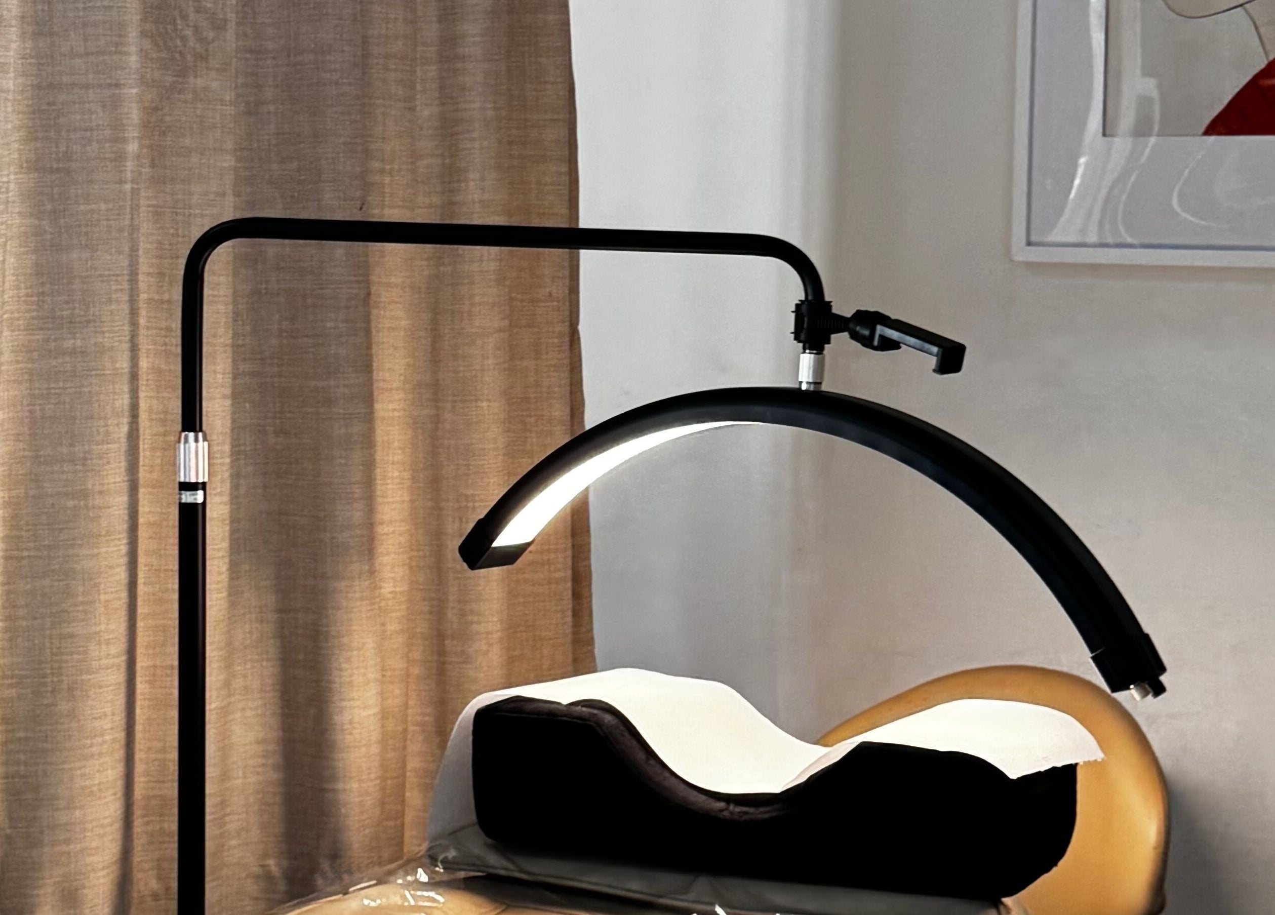 Relaxing treatment space at All-Eyes Beauty, Falcon, Western Australia with cozy lighting and cushions.