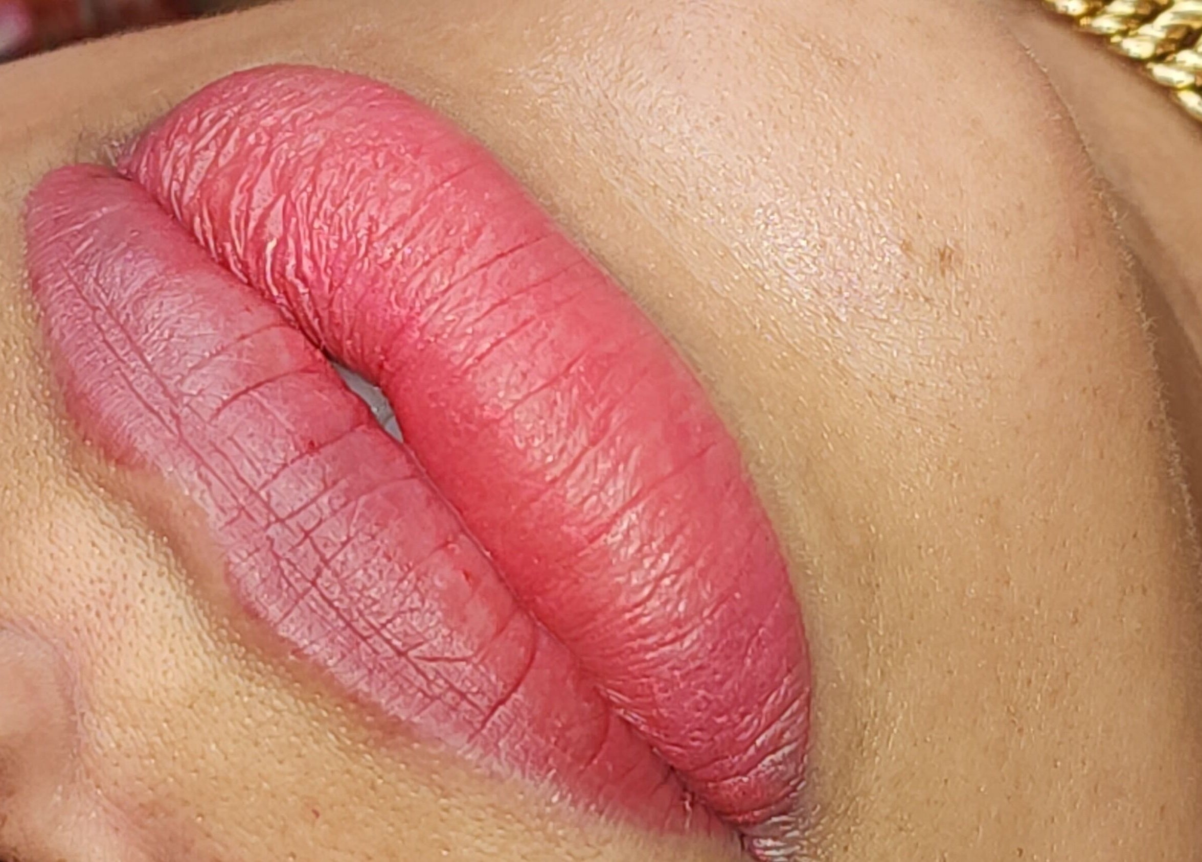 Vibrant pink lips transformed at Sparkle with Love Beauty Bar in Hialeah, Florida, US.