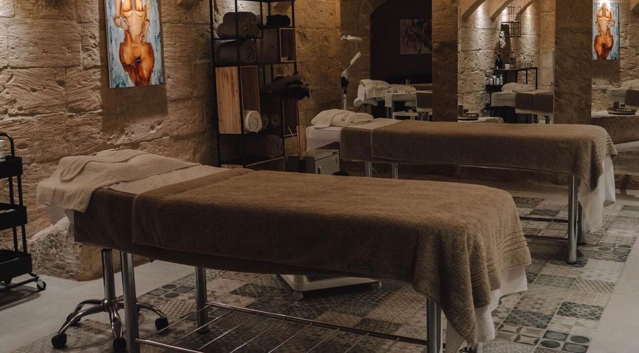 Luxurious spa beds at The Girls Valletta, Valletta, MT, offering serene wellness experiences.