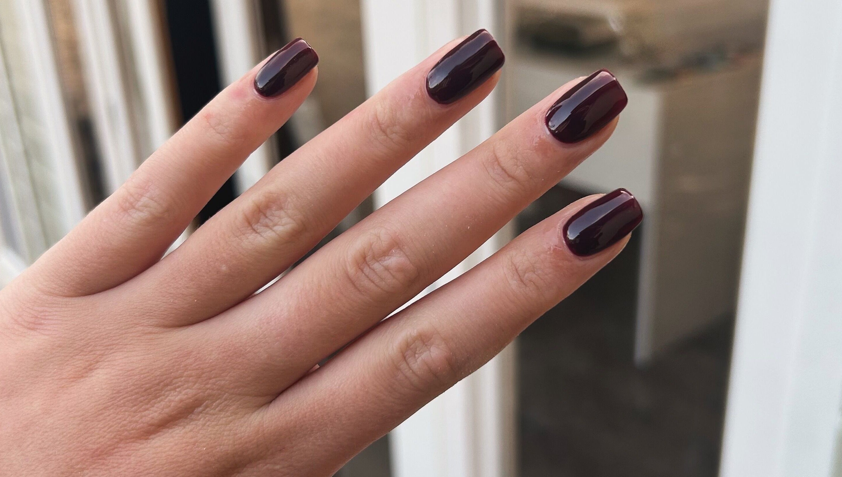 Dark polished nails at RJ Beauty & Aesthetics, Dalkeith, Scotland, GB showcasing elegance.