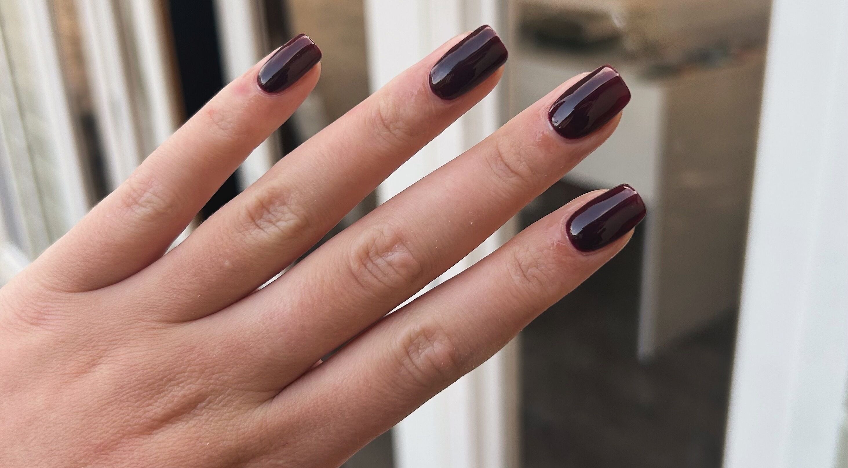 Dark polished nails at RJ Beauty & Aesthetics, Dalkeith, Scotland, GB showcasing elegance.