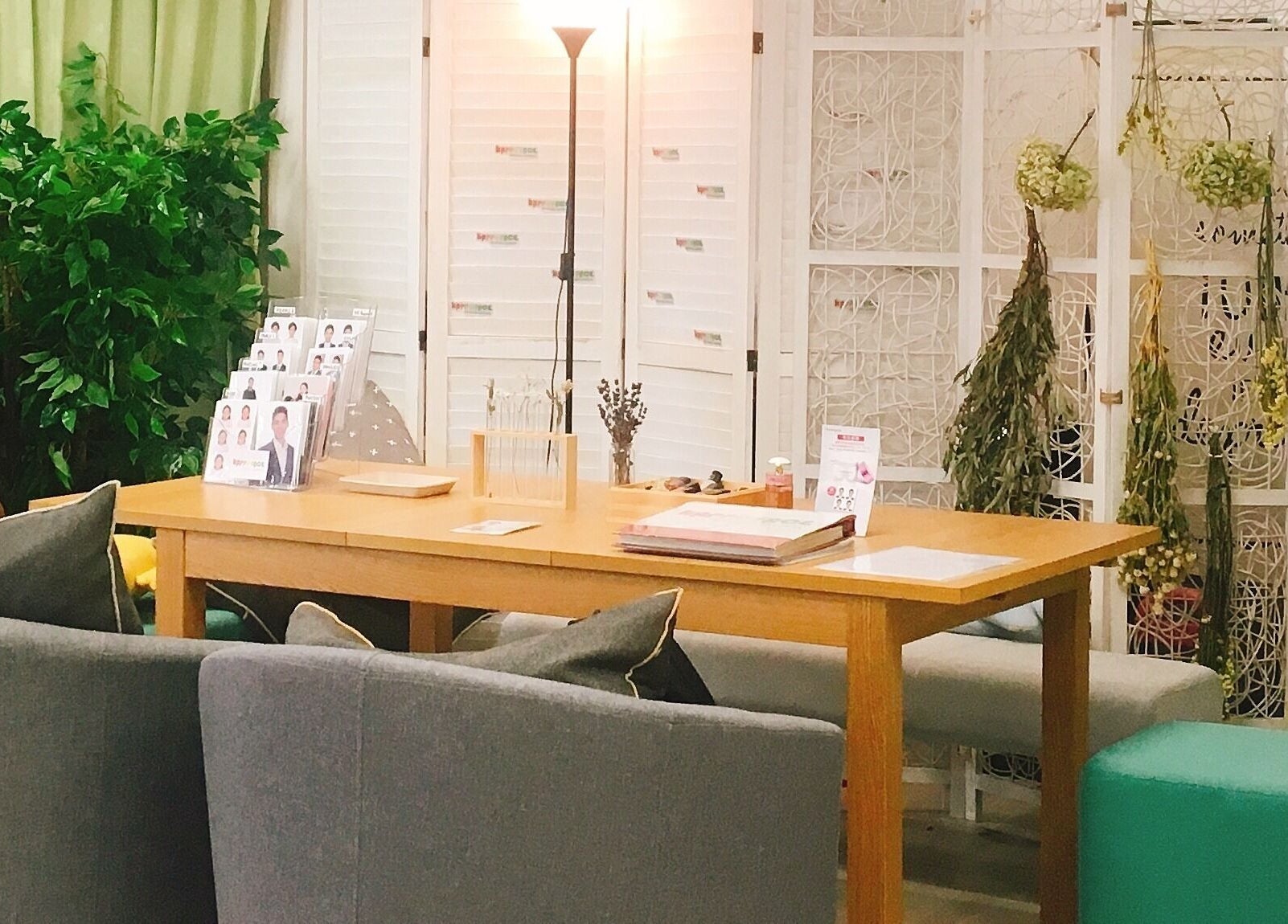 Cozy interior of Happy Face Photo Synthesis in Kowloon, HK, featuring modern decor and greenery.
