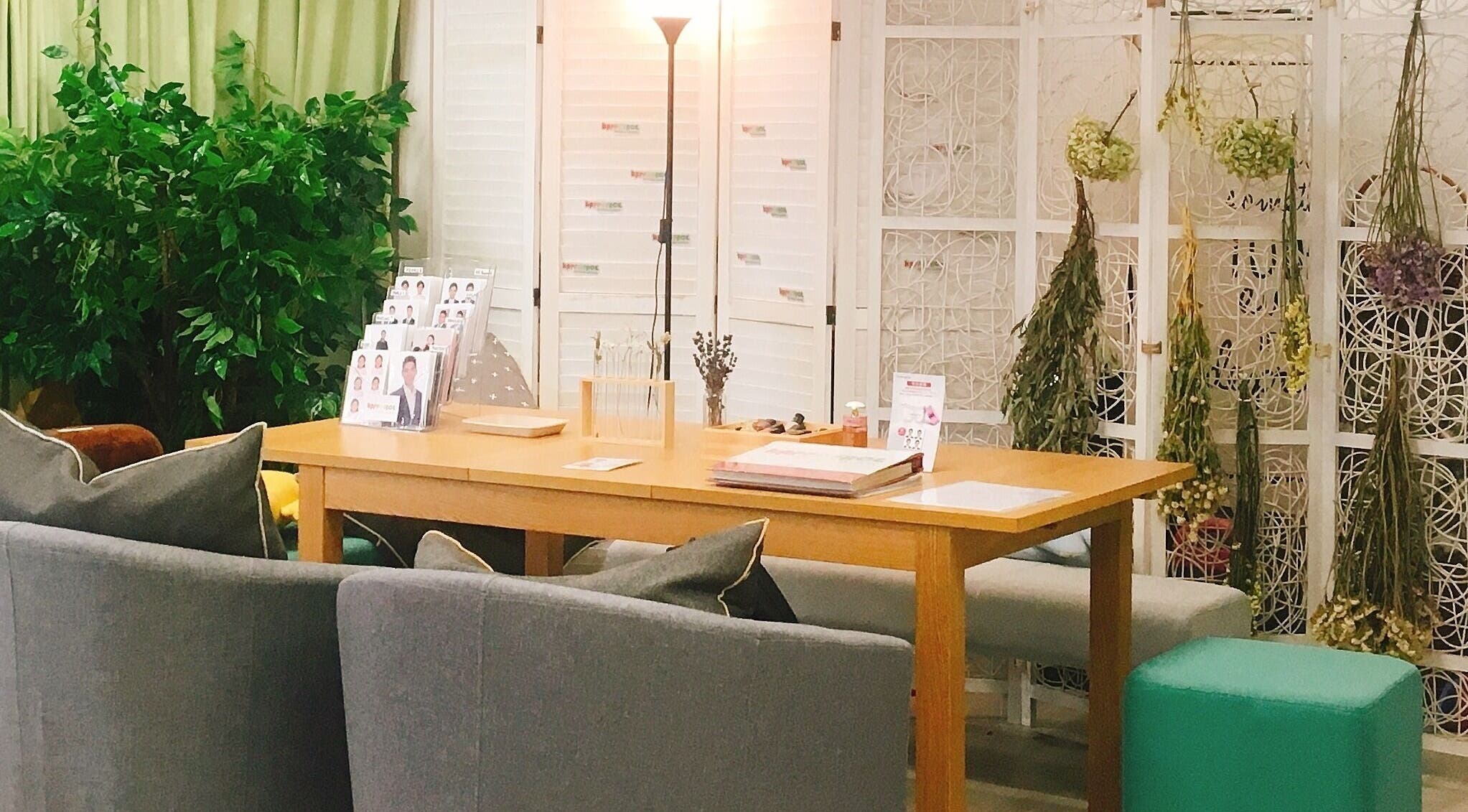 Cozy interior of Happy Face Photo Synthesis in Kowloon, HK, featuring modern decor and greenery.