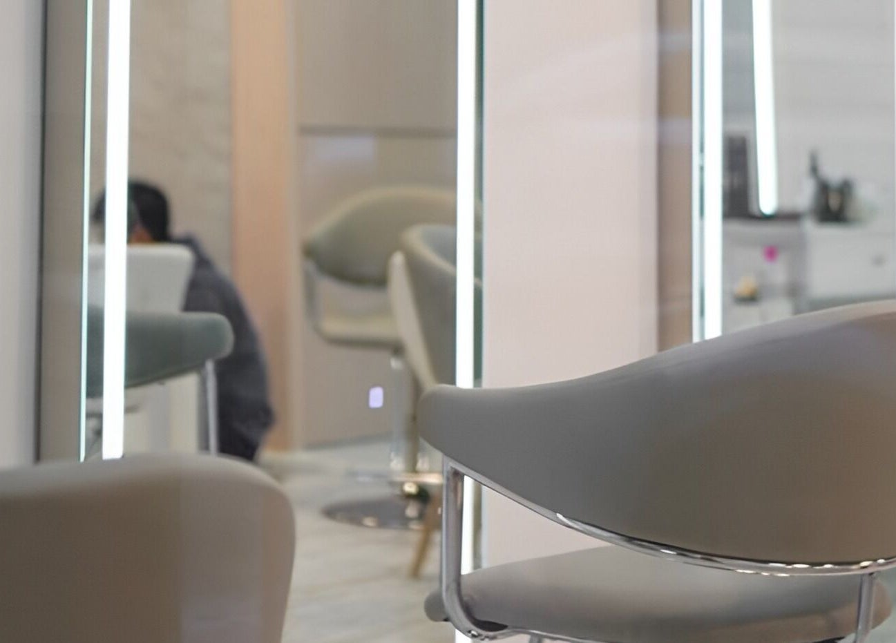 Modern salon interior with sleek chairs at Happy Face Photo Synthesis, Kowloon, HK.
