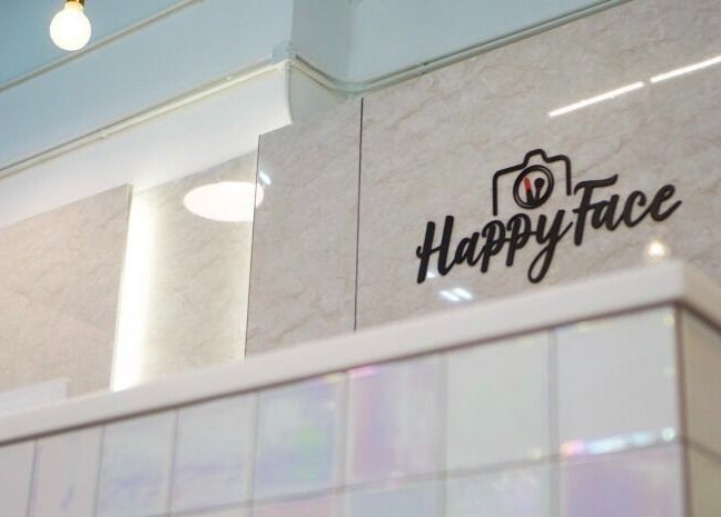 Chic interior of Happy Face Photo Synthesis in Kowloon, HK, featuring stylish lighting and decor.