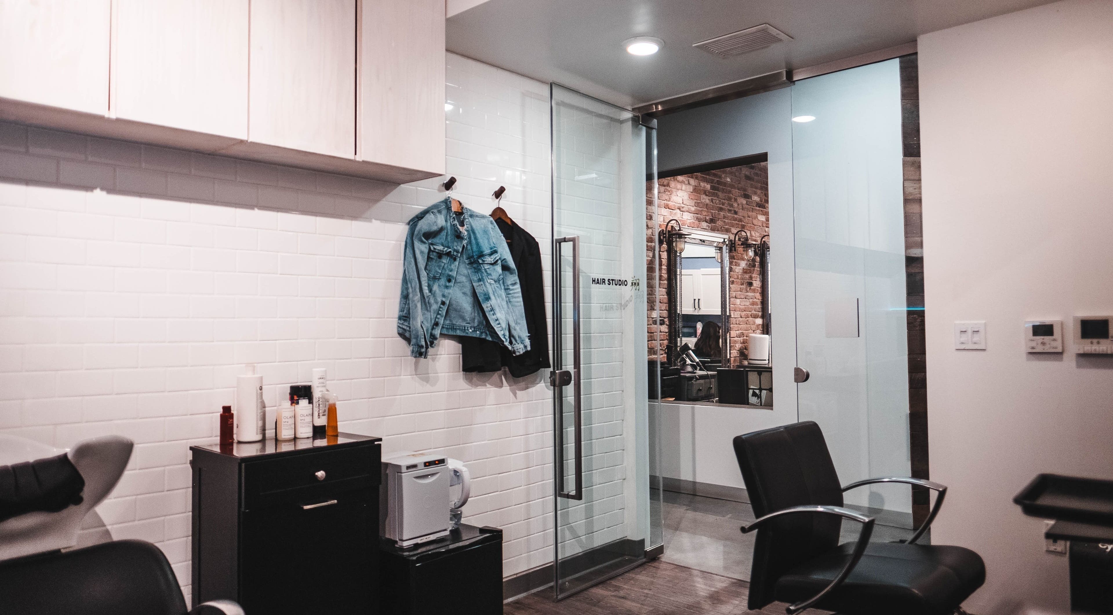 Modern interior of Hair Studio Sho in San Francisco, California, US with stylish decor and seating.