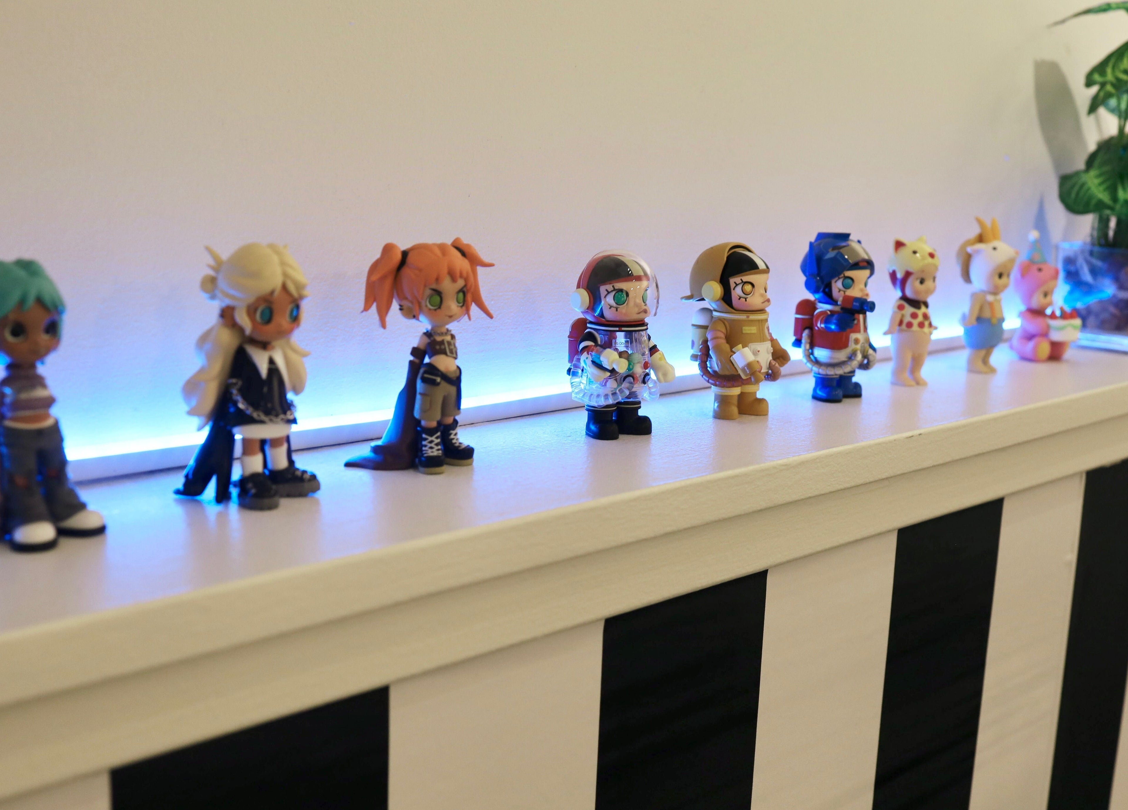 Stylish figurines at Hair Studio Sho, San Francisco, California, US, enhance the salon's modern decor.