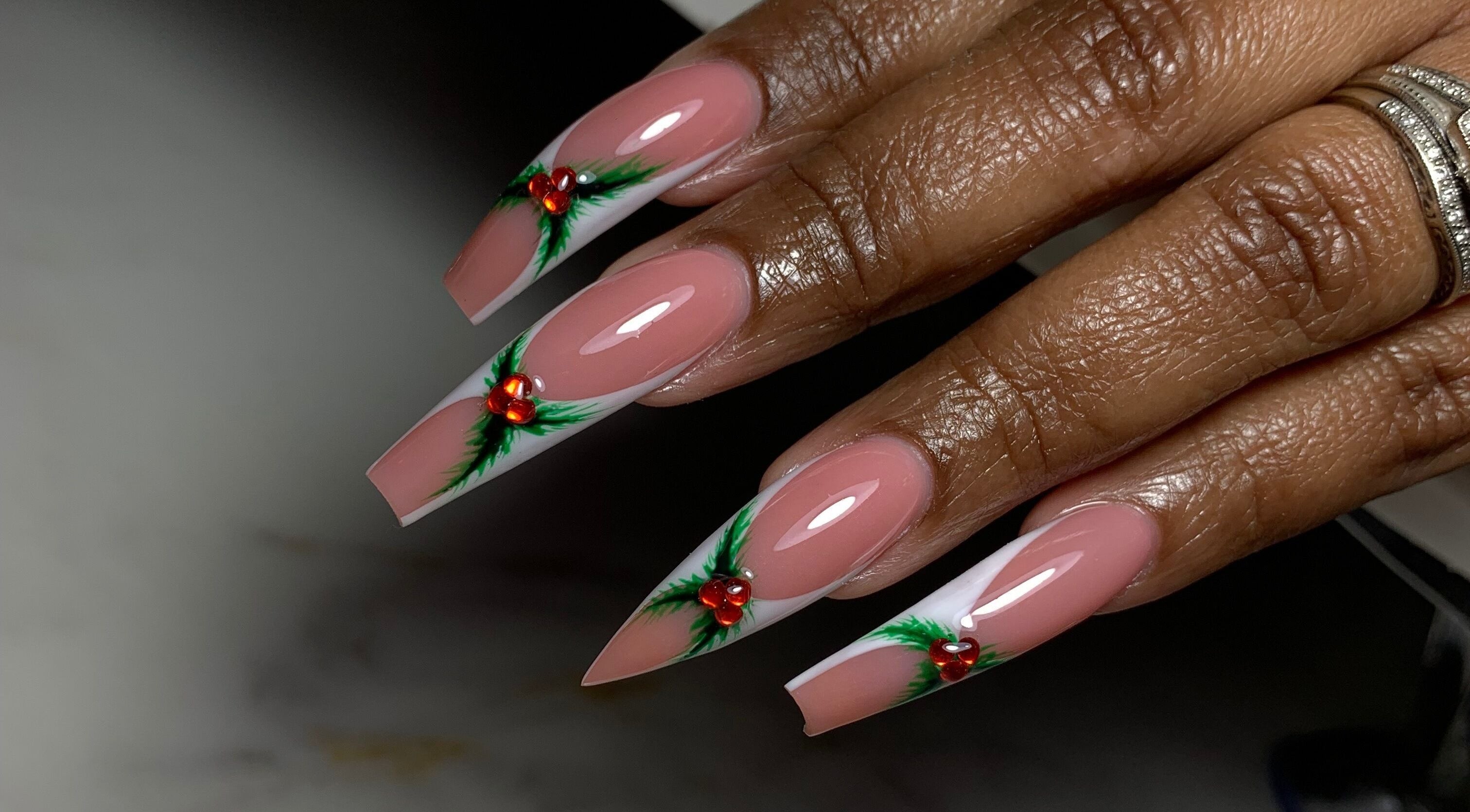 Elegant festive nail art with red and green accents, done at XxClusive Nails, Bridgetown, Saint Michael, BB.
